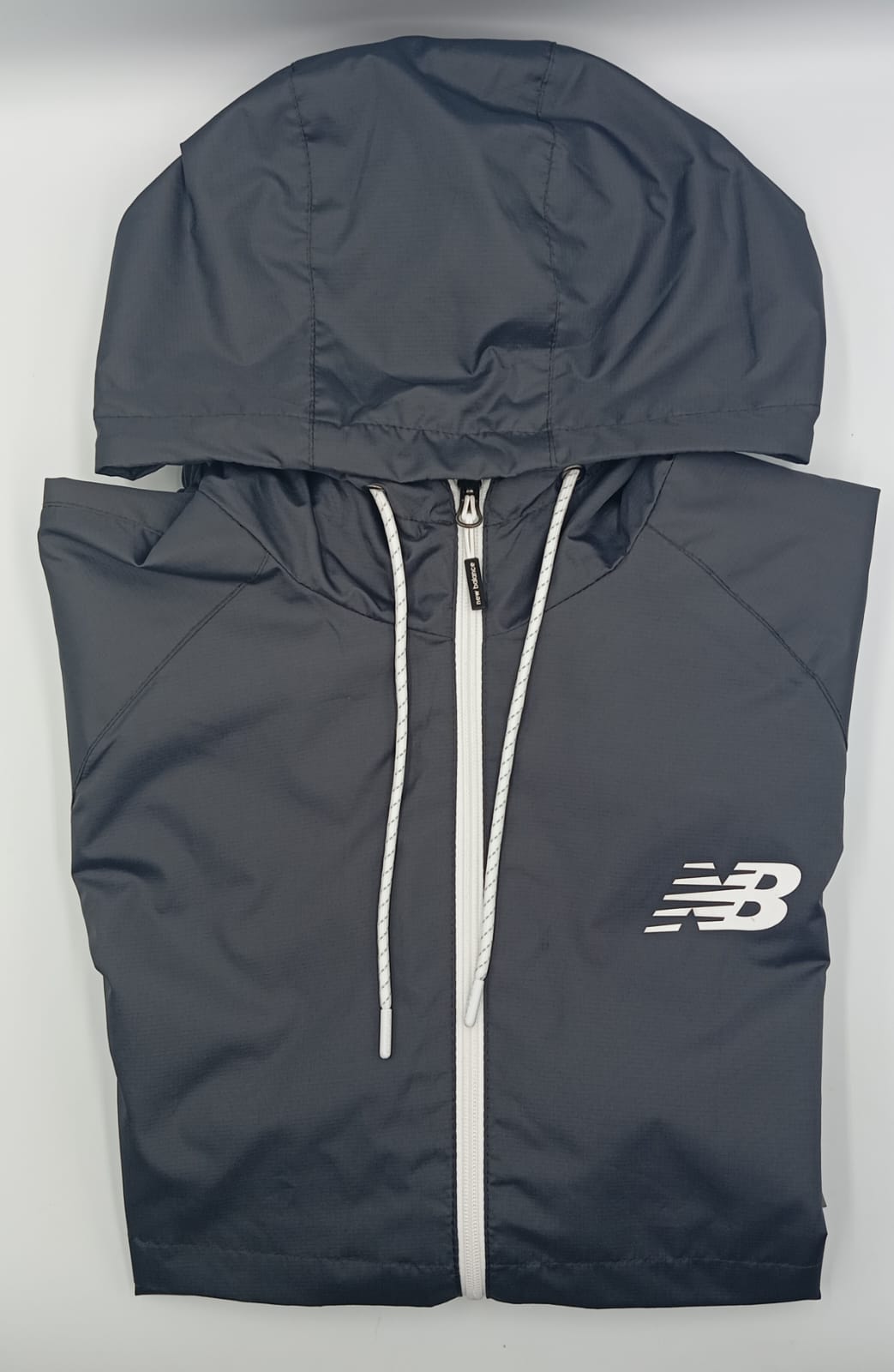 NEW BALANCE Rompe vientos Caballero