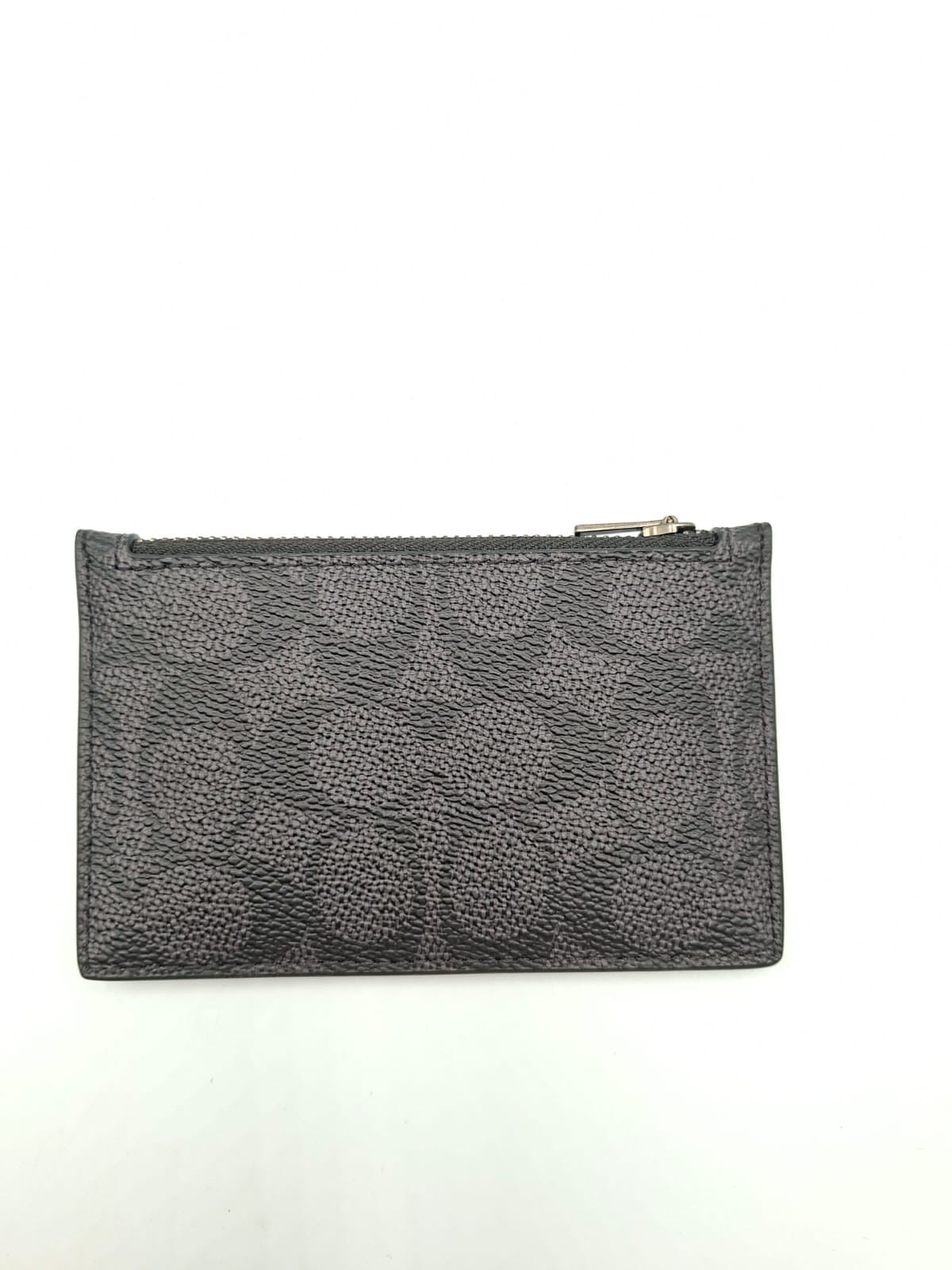 Tarjetero con cremallera Coach en lona de firma (Signature Canvas)
Coach Zip Card Case